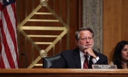 Sen. Gary Peters, D-Mich., listens during a congressional hearing on July 21, 2022. Peters criticized the Federal Acquisition Regulatory Council for delaying implementation of legislation he sponsored regarding contractor conflicts of interest that was signed into law in 2022.