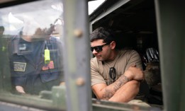 A FEMA response team member works with a guard member at Crooked Creek Fire Department near Old Fort in the aftermath of Hurricane Helene on Sept. 30 in Old Fort, North Carolina.