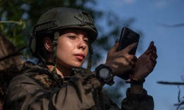 Kateryna Petrenko, press officer of Ukraine's 148th Artillery Brigade, takes video on May 6, 2024, in Donetsk Oblast, Ukraine.