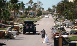 A man drags storm debris in the aftermath of Hurricane Milton on Oct. 10, 2024 in Englewood, Florida.