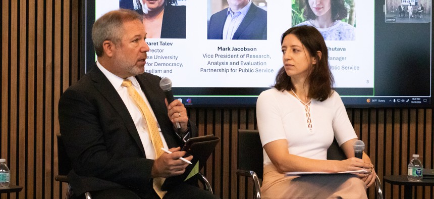 Partnership for Public Service's Mark Jacobson and Nadzeya Shutava discuss findings from their research about young Americans' relationship with the federal government at an event on Thursday. 