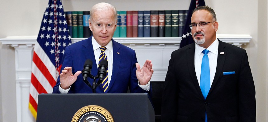 President Joe Biden speaking about student debt relief back in 2022 with Education Secretary Miguel Cardona.