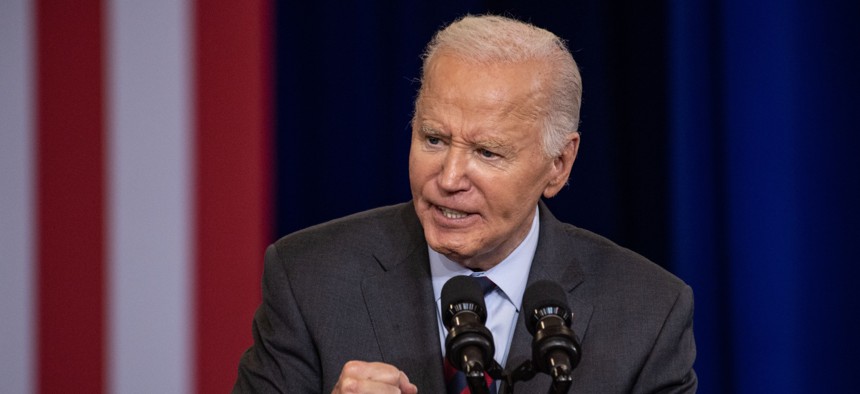 President Joe Biden, speaking at NHTI-Concord Community College in Concord, New Hampshire on Oct. 22, again denounced former President Donald Trump's plan to make the federal civil service at-will employees.