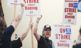 Union members react as Aerospace Machinists District 751 President Jon Holden (out of frame) announces that union members rejected a proposed Boeing contract and will go on strike, following voting results at their union hall in Seattle, Washington, on September 12, 2024.