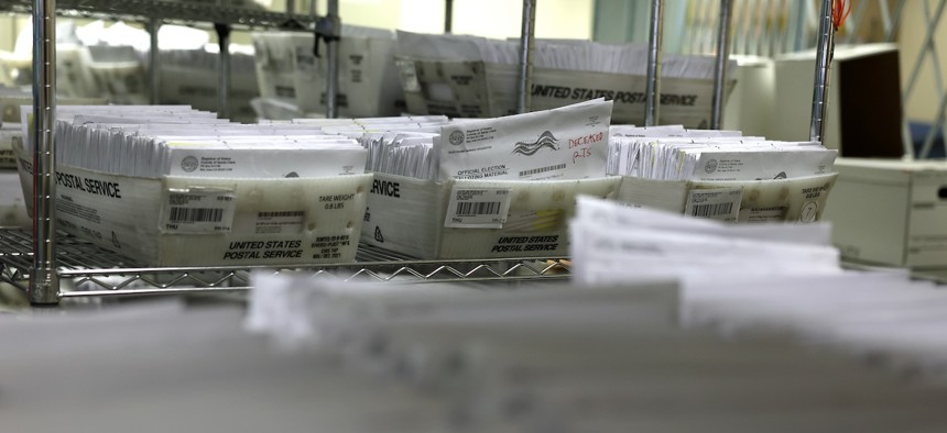 Trays of mail-in ballots are stacked at the Santa Clara County registrar of voters office on Oct. 21, 2024 in San Jose, Calif. Early voting for the 2024 presidential election began on Oct. 7 in California. 