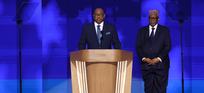 Everett Kelly, left, National President of the American Federation of Government Employees, and Imam Muhammad Abdul-Aleem deliver the Invocation during the final day of the Democratic National Convention at the United Center on Aug. 22, 2024 in Chicago, Illinois