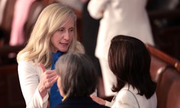 Rep. Abigail Spanberger, D-Va., talks with fellow members of Congress ahead of President Joe Biden's State of the Union address on March 7, 2024. Spanberger has co-sponsored legislation to repeal two tax provisions affecting some retired federal employees.