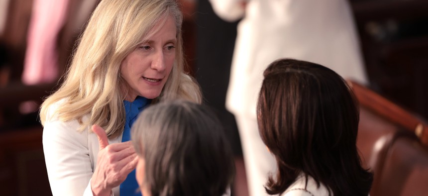 Rep. Abigail Spanberger, D-Va., talks with fellow members of Congress ahead of President Joe Biden's State of the Union address on March 7, 2024. Spanberger has co-sponsored legislation to repeal two tax provisions affecting some retired federal employees.