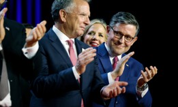 Speaker of the House Mike Johnson, R-La., applauds on stage as President-elect Donald Trump holds an election night event on Nov. 6, 2024 in West Palm Beach, Florida.