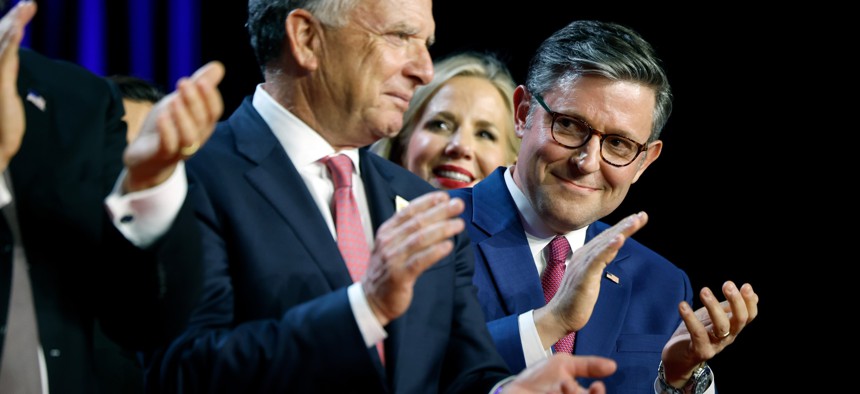 Speaker of the House Mike Johnson, R-La., applauds on stage as President-elect Donald Trump holds an election night event on Nov. 6, 2024 in West Palm Beach, Florida.