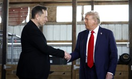  BUTLER, PENNSYLVANIA - OCTOBER 05: Elon Musk (L) shakes hands with Republican presidential nominee, former President Donald Trump back stage during a campaign rally at the Butler Farm Show grounds on October 05, 2024 in Butler, Pennsylvania.