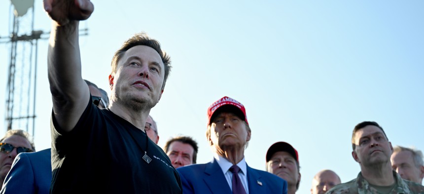 BROWNSVILLE, TEXAS - NOVEMBER 19: Elon Musk speaks with U.S. President-elect Donald Trump and guests at a viewing of the launch of the sixth test flight of the SpaceX Starship rocket on November 19, 2024 in Brownsville, Texas. SpaceX’s billionaire owner, Elon Musk, a Trump confidante, has been tapped to lead the new Department of Government Efficiency alongside former presidential candidate Vivek Ramaswamy.