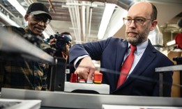 Acting OMB director Russ Vought presses the button that starts the machine that will print copies of President Donald Trump's proposed fiscal 2021 budget at the Government Publishing Office on Feb. 6, 2020. President-elect Trump is reported to have selected Vought to lead OMB again.