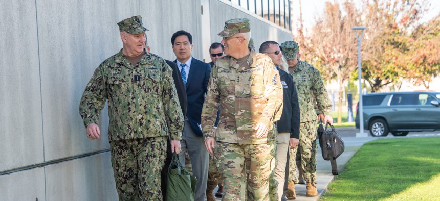 Vice Chairman of the Joint Chiefs of Staff Adm. Christopher Grady and the commander of Space Systems Command, Lt. Gen. Philip Garrant, talk while walking to SSC headquarters on Los Angeles Air Force Base in El Segundo Calif., March 7, 2024. 