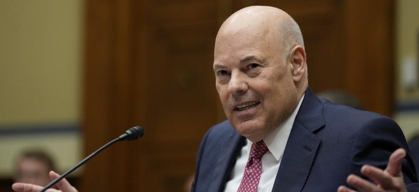 Postmaster General Louis DeJoy testifies during a hearing on Capitol Hill in May 17, 2023. He said Tuesday that USPS will cautiously proceed with his operational plans. 