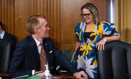 Sen. James Lankford, R-Okla., talks with Sen. Kyrsten Sinema, D-Ariz., prior to a Senate Committee on Finance hearing on Oct. 19, 2021. Lankford and Sinema's Chance to Compete Act will soon head to the president's desk.