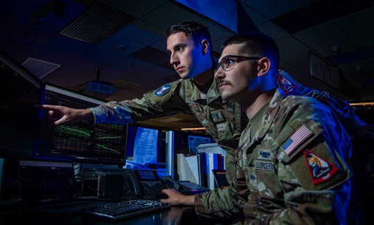 1st Lt. Jason Kaynak, 4th Space Operations Squadron Mission Planning Cell tactician, trains with Spc. 4 Jack Wallace, 4 SOPS MPC tactician, at Schriever Space Force Base, Colo., Sept. 19, 2024.