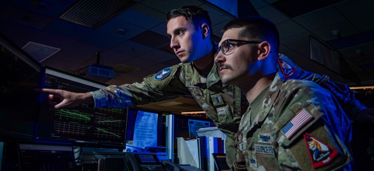 1st Lt. Jason Kaynak, 4th Space Operations Squadron Mission Planning Cell tactician, trains with Spc. 4 Jack Wallace, 4 SOPS MPC tactician, at Schriever Space Force Base, Colo., Sept. 19, 2024.