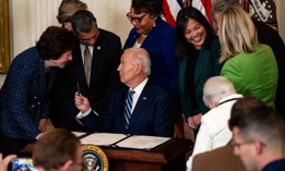 President Biden is greeted by Sen. Susan Collins, R-Maine, as he prepares to sign the Social Security Fairness Act on Jan. 5, 2025.