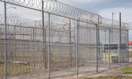 A fence at the Port Isabel Detention Center during a media tour hosted by Immigration and Customs Enforcement on June 10, 2024, in Los Fresnos, Texas. ICE said that it would need more than 10,000 enforcement and removal personnel to implement the Laken Riley Act. 