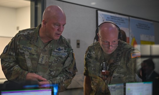 In this 2021 photo, then-Space Operation Chief Gen. Jay" Raymond, left, speaks with then-Brig. Gen. Stephen Purdy at Cape Canaveral Space Force Station, Fla.