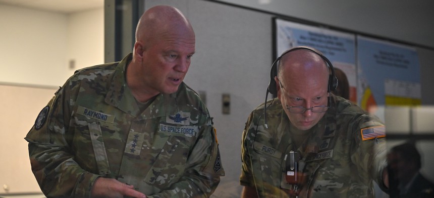 In this 2021 photo, then-Space Operation Chief Gen. Jay" Raymond, left, speaks with then-Brig. Gen. Stephen Purdy at Cape Canaveral Space Force Station, Fla.