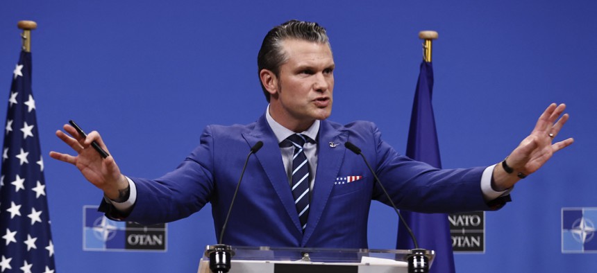 Defense Secretary Pete Hegseth speaks to reporters after a NATO defense ministers meeting in Brussels on February 13, 2025.