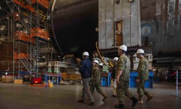 Navy leaders meet with officials from General Dynamics Electric Boat while touring the facility in Quonset Point, R.I., Oct. 19, 2023.