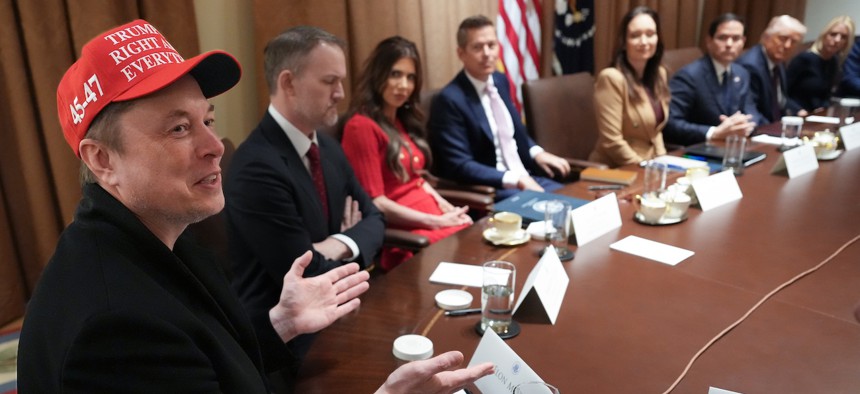 Elon Musk, left, speaks during a cabinet meeting held by President Trump at the White House on March 24, 2025. This was Trump's third cabinet meeting of his second term, and it focused on spending cuts proposed by the Department of Government Efficiency (DOGE).