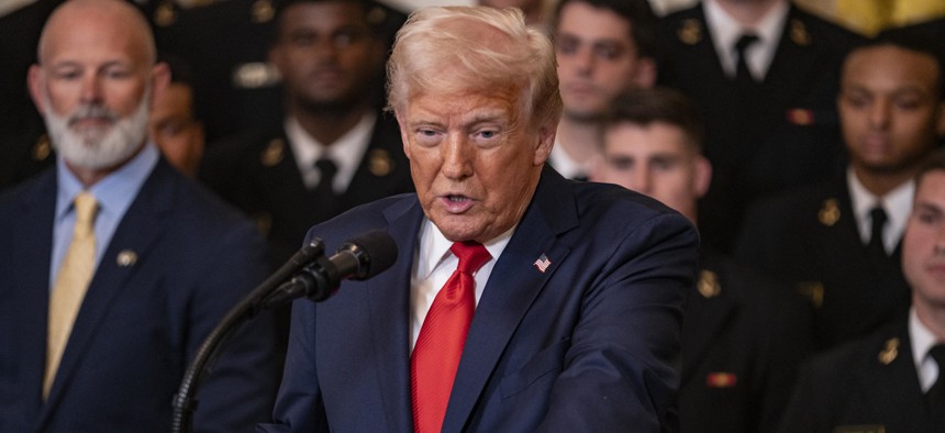 President Donald Trump presents Commander-in-Chief Trophy to the Navy Midshipmen the United States Naval Academy football team on April 15, 2025, in Washington, D.C. That same day Trump issued a memo calling for updated technology to reform permitting.