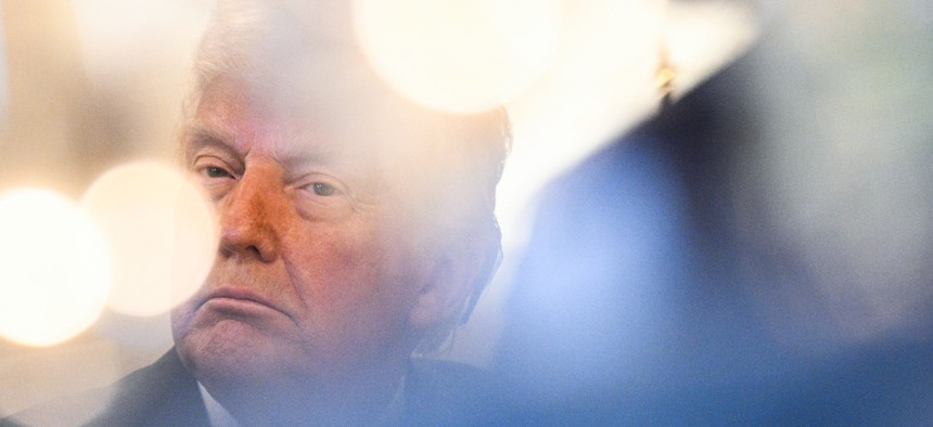 US President Donald Trump attends an Easter prayer service and dinner in the Blue Room of the White House in Washington, DC, on April 16, 2025. Trump signed two executive orders April 15 aiming to reform government procurement.