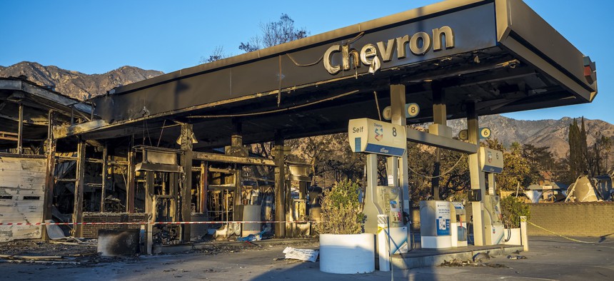 A view of a burned gas station in ruins in Altadena, California, following wildfires that swept through the city in January 2025.