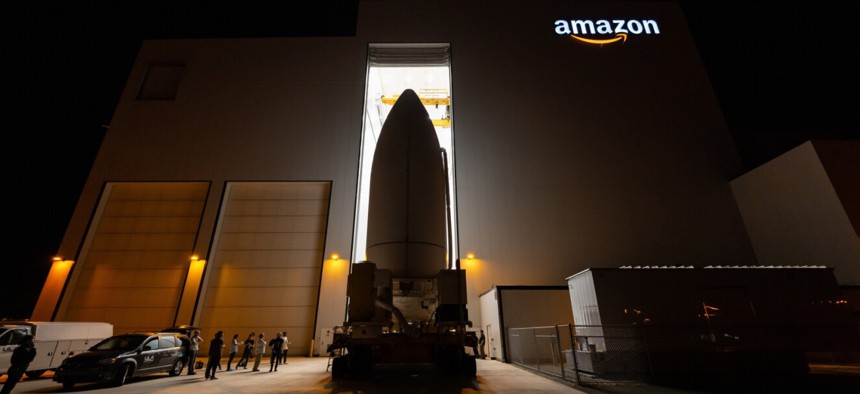 The payload fairing, containing 27 Project Kuiper satellites, departs Amazon's satellite processing facility.