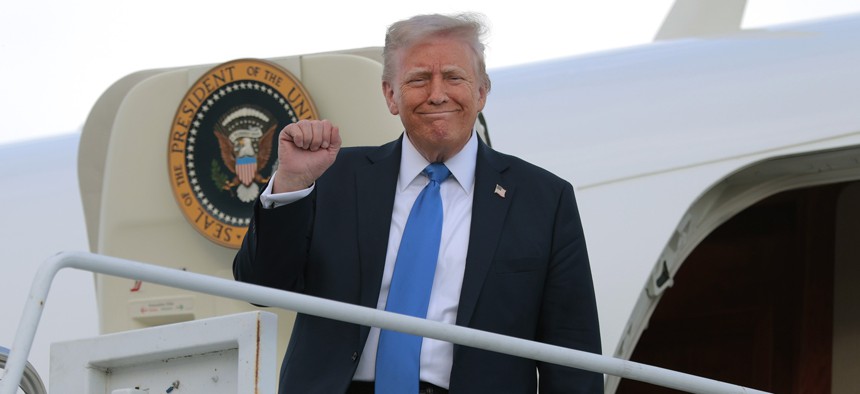 President Donald Trump disembarks from Air Force One at Tuscaloosa National Airport on May 1, 2025 in Tuscaloosa, Alabama. Trump released his "skinny" budget proposal May 2 with sweeping cuts to civilian agencies.