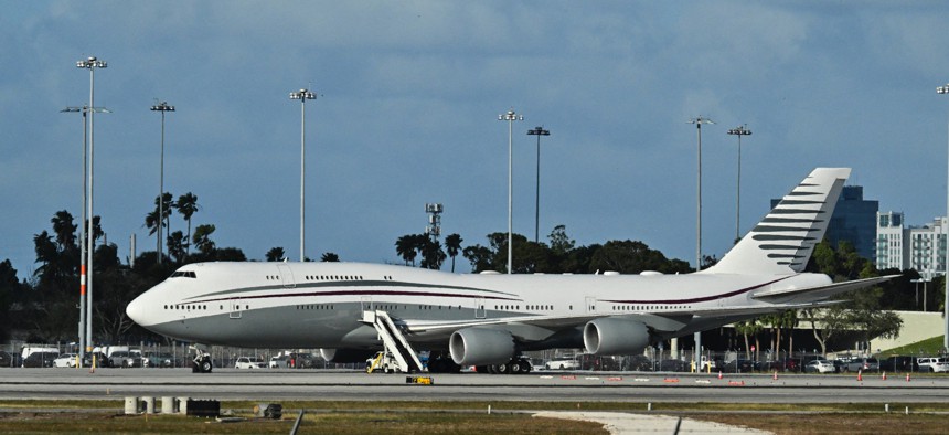 A Qatari Boeing 747 sits on the tarmac of Palm Beach International airport after President Trump toured the aircraft on Feb. 15, 2025.
