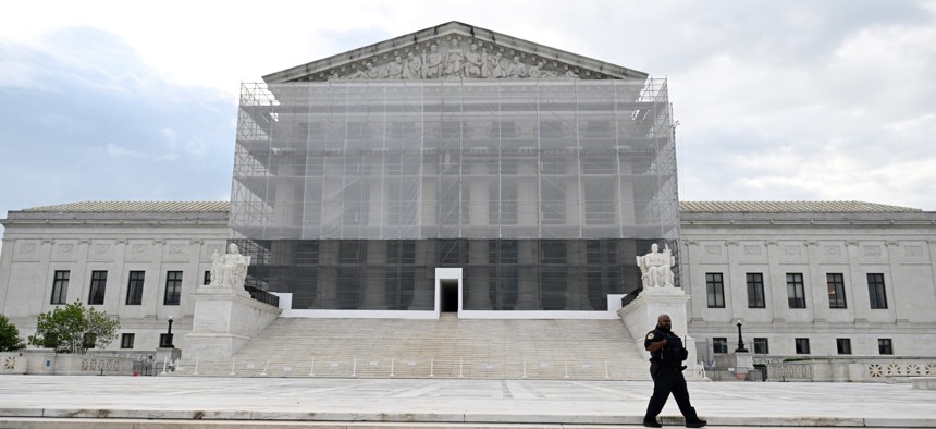 A police officer is seen outside the Supreme Court on May 15, 2025, in Washington, D.C.