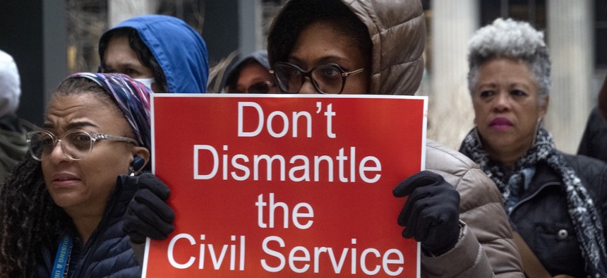 Federal employees rally in support of their jobs outside of the Kluczynski Federal Building in Chicago, on March 19, 2025. The rally was organized by the National Treasury Employees Union to voice concerns about the mass firing of federal workers by the Department of Government Efficiency (DOGE).