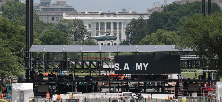 Workers put up temporary fencing ahead of the Army's 250th birthday parade and celebration on June 9, 2025 in Washington, D.C.