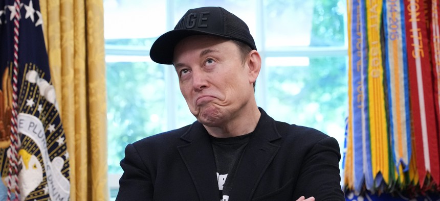 Tesla CEO Elon Musk speaks alongside President Trump to reporters in the Oval Office of the White House on May 30, 2025 in Washington, D.C. Musk, who served as an adviser to Trump and led the Department of Government Efficiency, announced he would leave his role in the Trump administration to refocus on his businesses.