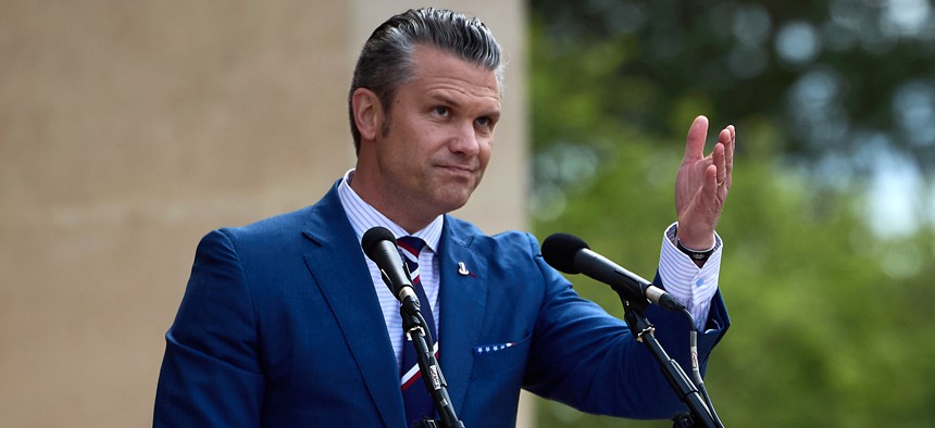 Defense Secretary Pete Hegseth gestures as he speaks during a ceremony at the Normandy American Cemetery to mark the 81st anniversary of the D-Day landings during World War II on June 6, 2025 in Colleville-sur-Mer, France