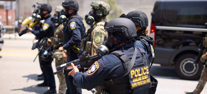 Immigration and Customs Enforcement and Department of Homeland Security agents take security measures as protests and confrontations between immigration rights supporters and law enforcement continue in Paramount, California, and downtown Los Angeles, California, on June 8, 2025.