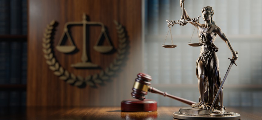 A former contracting officer with the U.S. Agency for International Development pled guilty to bribery of a public official, alongside three former contracting executives.