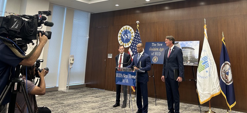 Public Buildings Service Commissioner Michael Peters, Housing and Urban Development Secretary Scott Turner and Virginia Gov. Glenn Youngkin (from left to right) speak at a press conference on June 25.