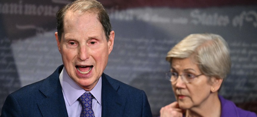 US Senator Ron Wyden, Democrat from Oregon, alongside Senator Elizabeth Warren, Democrat from Massachusetts, speaks during a news conference about protecting Social Security benefits on April 1, 2025, in Washington, DC. They joined Sens. Kirsten Gillibrand, D-N.Y., and Bernie Sanders, I-Vt., in sending a letter to the SSA head June 24 demanding answers about the agency's use of AI.