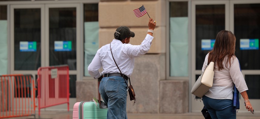 Former U.S. Agency for International Development employees terminated after the Trump administration dismantled the agency collect their personal belongings at the USAID headquarters on Feb. 27, 2025 in Washington, D.C.