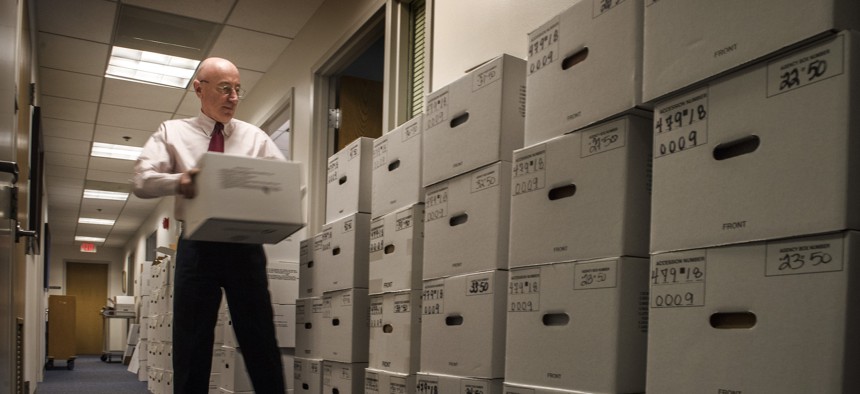 Mark Robbins — former vice chairman and acting chairman of the Merit Systems Protection Board, on Feb. 6, 2019, when he was the only appointed person remaining on the board — with some backlogged case files. A public employees nonprofit is warning that the agency is once again headed toward a backlog in appeals.
