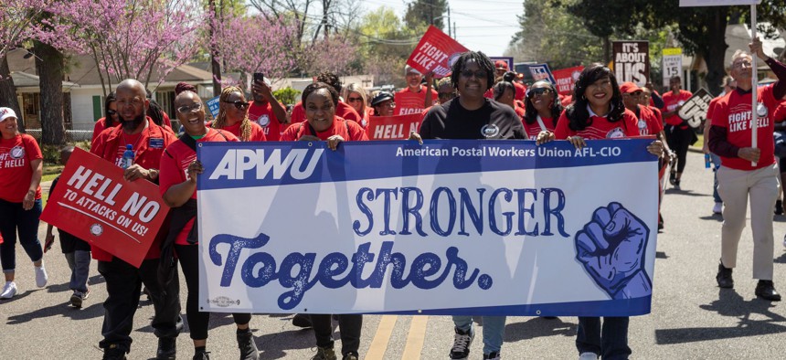 Members of the American Postal Workers Union during a March 23, 2025, march in Montgomery, Ala., commemorating the 60th anniversary of the Selma to Montgomery civil rights march. The union ratified a new collective bargaining agreement on Thursday.
