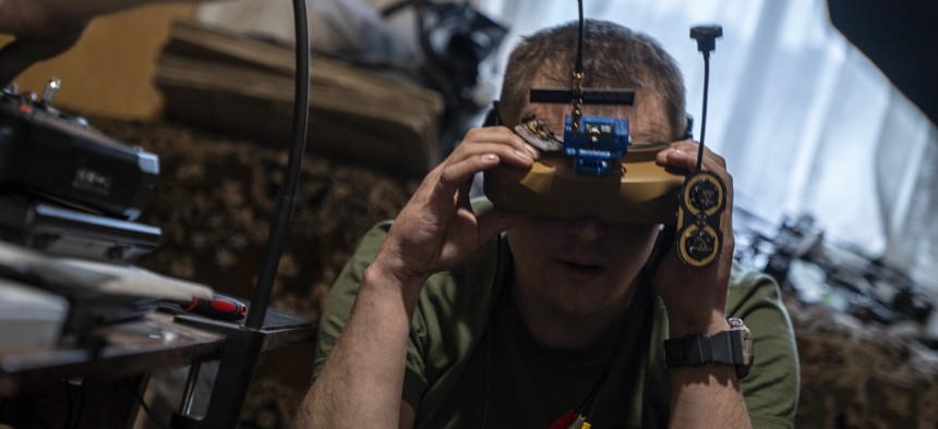 Ukrainian military personnel work at an FPV drone assembly center in Donetsk Oblast, Ukraine, May 14, 2025.