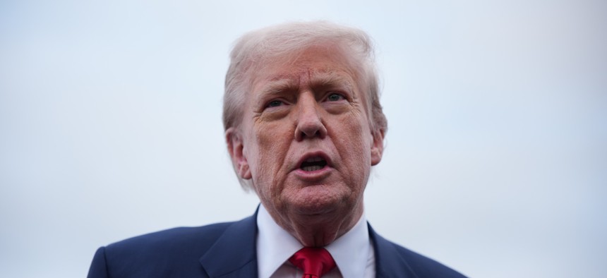 President Donald Trump speaks to the media as he arrives at Glasgow Prestwick Airport on July 25, 2025, in Prestwick, Scotland. Trump has removed several inspectors general during his second term.
