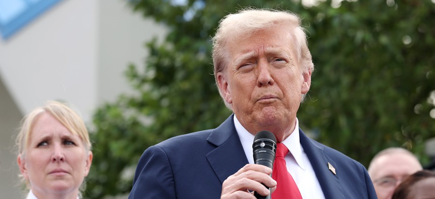 President Donald Trump visits the U.S. Park Police Anacostia Operations Facility on Aug. 21, 2025, in Washington, D.C. Trump must issue an alternative pay plan for federal employees by the end of the month.